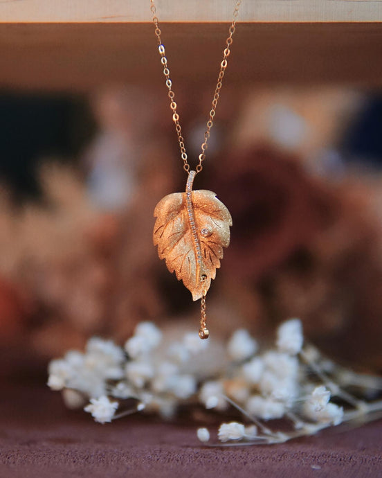 18k gold leaf pendant with diamonds