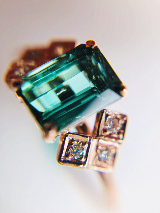 Bluish Green Tourmaline with checked diamond studded side